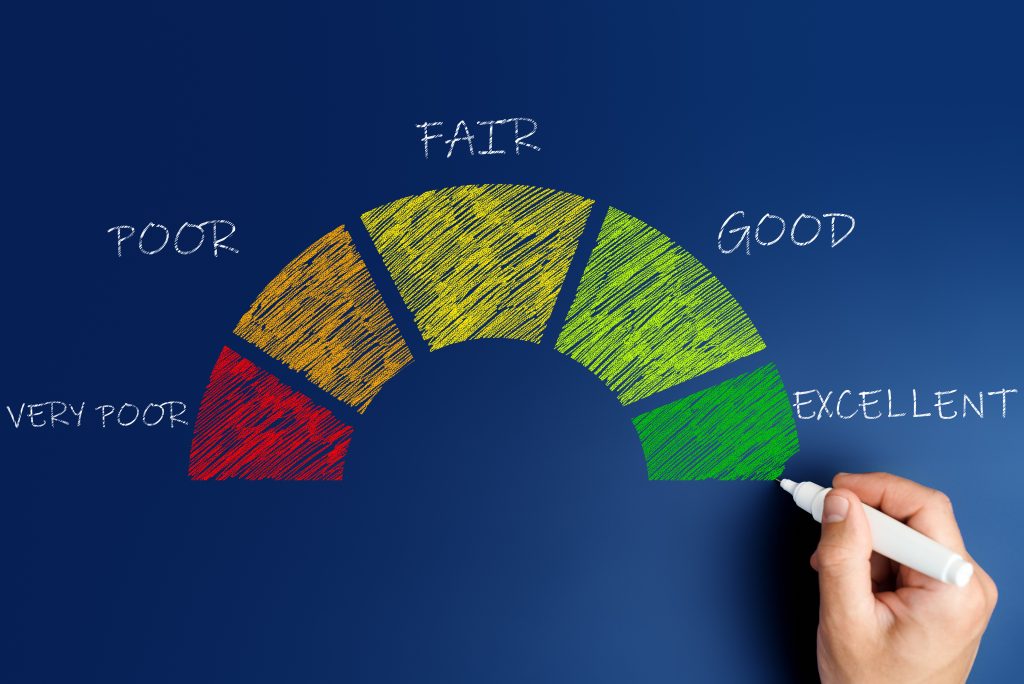 credit score concept, male hand draws a chart with credit histor