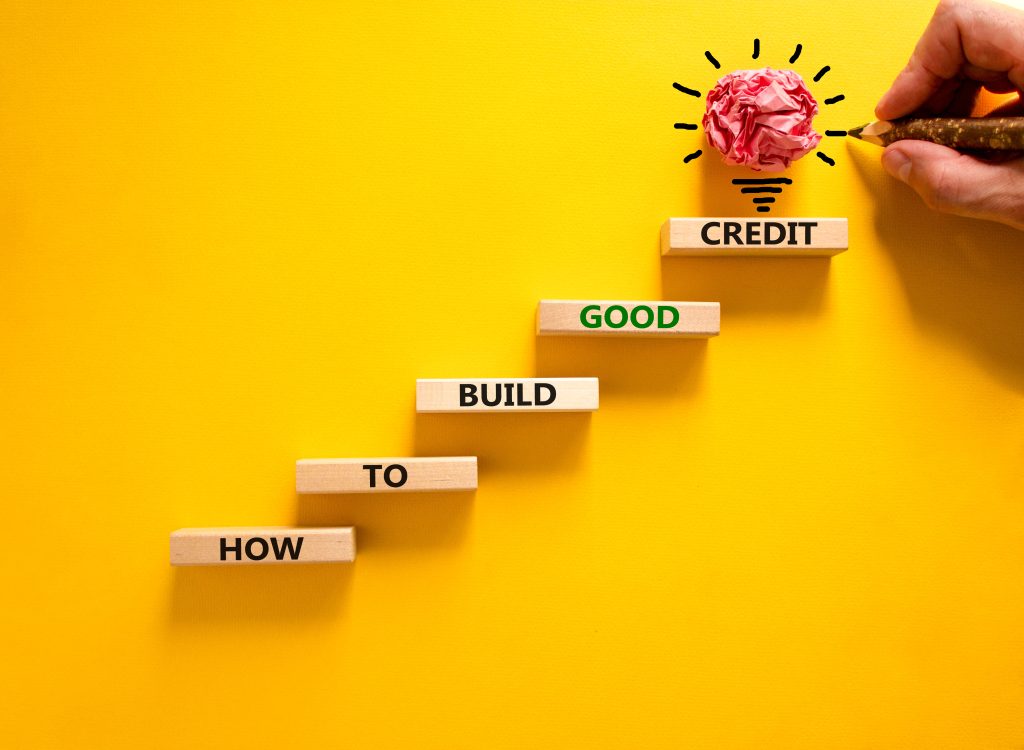 Build good credit symbol. Wooden blocks, words How to build good credit