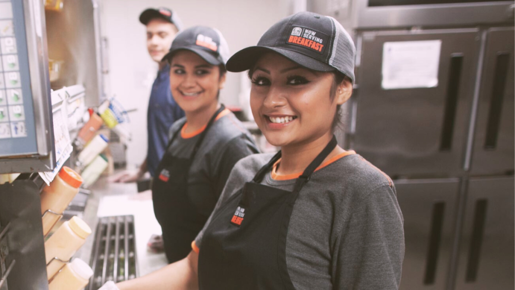 Taco Bell employees smiling