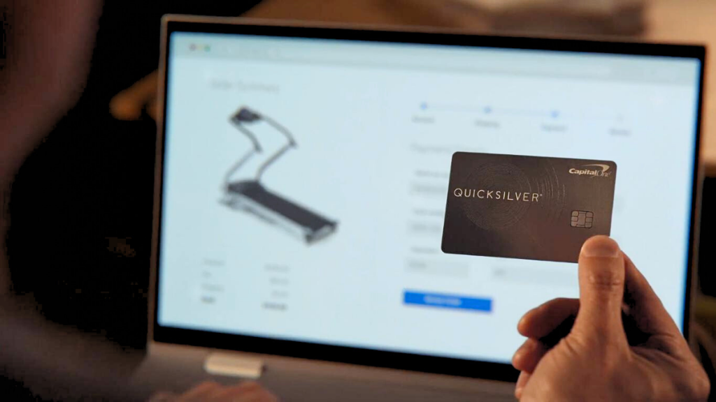 man shopping online with the Capital One Quicksilver Cash Rewards