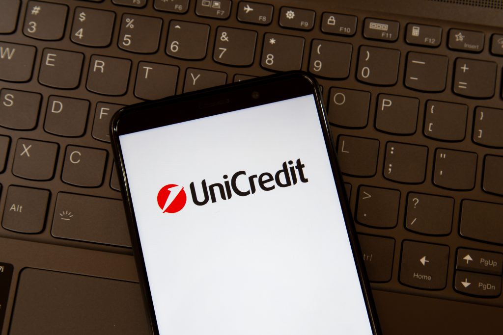 Toronto, On, Canada - December 19, 2021:  UniCredit logo on smartphone screen on a keyboard. UniCredit S.p.A. is an international banking group headquartered in Milan.